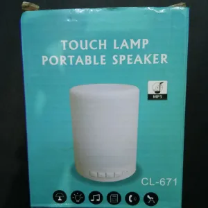 Touch lamp with portable speaker
